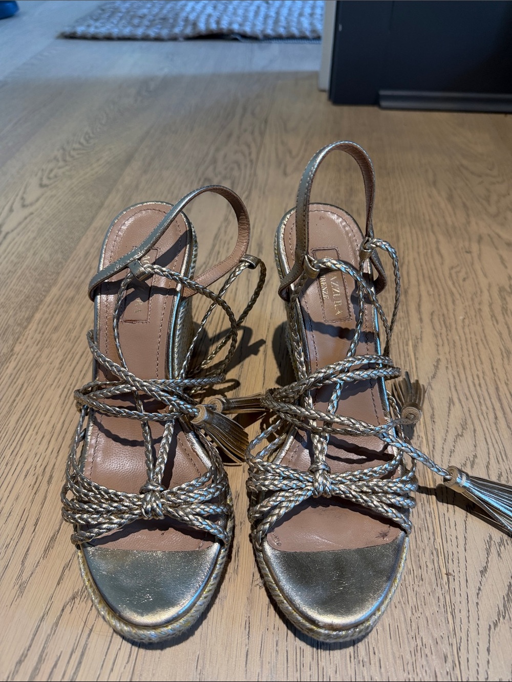 Aquazzura Braided Metallic Tassel Lace-Up Sandals in Gold